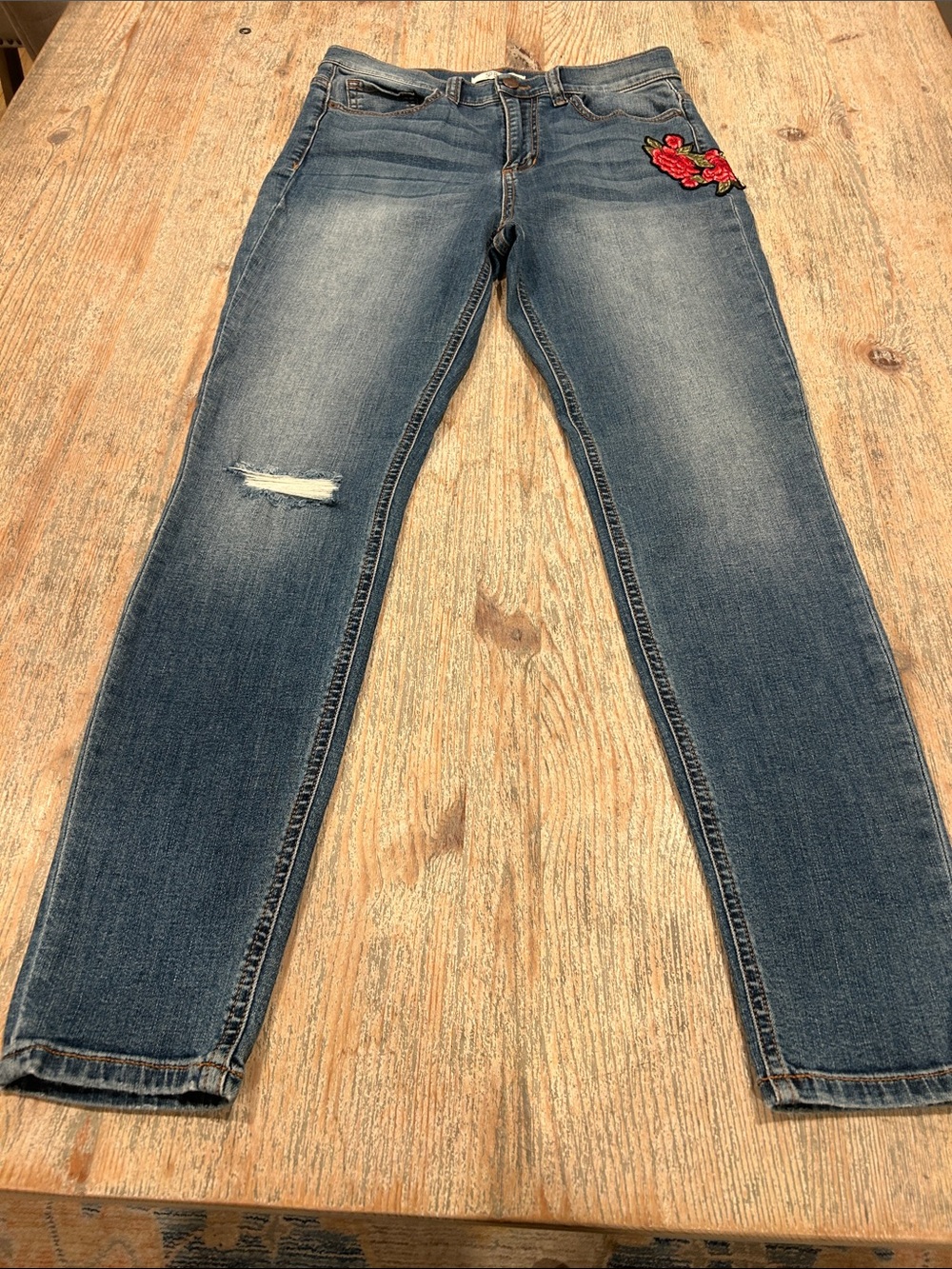 Women's Faded Blue Skinny Jeans with Red Floral Patch
